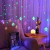 A room decorated with colorful snowflake string lights, a side table with a lamp and flowers, and a chair with a magazine rack. Náhled obrázku produktu