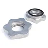 Two silver star-shaped nuts with threaded interiors and a black rubber ring on one of them, set against a white background. Produktbild-Vorschau