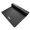 A black yoga mat rolled up on one end, lying flat on a white background. Podgląd zdjęcia produktu