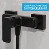 A close-up of a black shower faucet mounted on a tiled wall. Produktbild-Vorschau