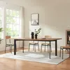 A dining room scene with a wooden table and chairs, set against a large window with natural light. Produktbild-Vorschau