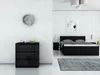 A modern bedroom with a black dresser and a black bed. Produktbild-Vorschau