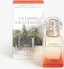 A bottle of Hermes Un Jardin Sur La Lagune Eau de Toilette and its packaging are displayed against a white background. Voir les images du produit