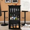A black bar cabinet with bottles, glasses, and jars, flanked by two bar stools, in a room with a window and artwork. Produktbild-Vorschau