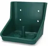A green plastic holder for a lick stone, designed to be mounted on a wall. Anteprima dell’immagine prodotto
