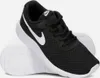 A pair of black Nike Tanjun sneakers with white accents, shown from a slightly angled side view on a white background. Podgląd zdjęcia produktu