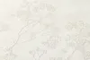 A close-up view of textured wallpaper with a subtle floral pattern. Podgląd zdjęcia produktu