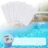 A pool skimmer basket with leaves in it, and a set of pool skimmer socks, set against a backdrop of a swimming pool with a waterfall. Produktbild-Vorschau