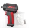 A black and red air impact wrench with a small plastic bottle and a connector in a plastic bag, all on a white background. Anteprima dell’immagine prodotto