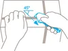 Hands demonstrating how to use a safety knife to cut a strap at a 45-degree angle. Produktbild-Vorschau