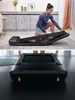 A woman is shown interacting with a foldable treadmill in a home setting, and then the treadmill is shown in its folded state. Produktbild-Vorschau