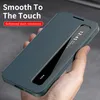 A hand holding a teal smartphone case with a transparent window. Náhled obrázku produktu