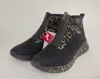 A pair of black ankle boots with a balloon pattern on a white background. Produktbild-Vorschau