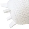 A close-up of a white planter with feet. Produktbild-Vorschau