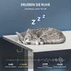 A sleeping cat on a desk with marketing text and sound level comparisons. Podgląd zdjęcia produktu
