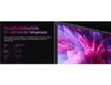 A laptop screen displaying a colorful abstract image, with marketing text on the left side. Produktbild-Vorschau