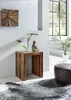 A wooden side table with decorative items and a plant in a modern living room setting. Podgląd zdjęcia produktu