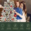 A mother and daughter decorating a white Christmas tree. Podgląd zdjęcia produktu