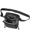 A black shoulder bag with its main compartment open, revealing internal pockets. Náhľad obrázku produktu