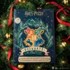A Harry Potter advent calendar is placed in a Christmas tree with red ribbons and gold ornaments. Náhled obrázku produktu