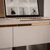 A close-up view of a modern desk with a laptop and drawers. Produktbild-Vorschau