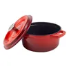 A red enameled cast iron pot with its lid slightly ajar, shown against a white background. Produktbild-Vorschau
