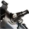 A close-up view of a telescope's eyepiece and focusing knobs. Náhled obrázku produktu