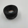 A camera lens is shown on a plain white background. Náhľad obrázku produktu