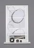 A window blind with a circular pattern is shown hanging in a window frame, with decorative spheres on the windowsill below. Produktbild-Vorschau