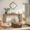 A living room scene with a console table, coffee table, armchair, and sofa. Produktbild-Vorschau