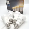 A product shot of Philips Hue smart bulbs with their packaging in the background. Náhled obrázku produktu