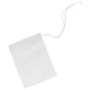 A single, empty tea bag with a string, isolated on a white background. Anteprima dell’immagine prodotto