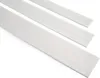 Three white plastic strips are laid out diagonally on a white background. Anteprima dell’immagine prodotto