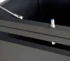 Close-up of a metal hinge and a blue-capped push-button on a dark gray object. Produktbild-Vorschau