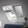 A bedroom with a bed and skylights. Produktbild-Vorschau