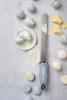 A Microplane grater is shown with macarons and chocolate. Náhled obrázku produktu
