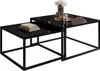A set of two nesting coffee tables with black glass tops and black metal frames, displayed on a white background. Produktbild-Vorschau
