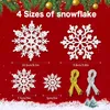 Four different sizes of white snowflakes are displayed against a red background, with green garland and gold ornaments at the top. Two bundles of ribbon, one gold and one silver, are shown on the right side. Small green Christmas trees are at the bottom ri Produktbild-Vorschau