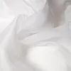 A close-up, abstract view of white, sheer fabric with soft folds and highlights. Produktbild-Vorschau