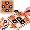 A collage of images showing a wooden tic-tac-toe game with orange 'X' pieces and black 'O' pieces. One image shows the game board with pieces placed, another shows loose pieces, and a third shows a hand placing a piece on the board. Náhled obrázku produktu