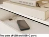 A close-up view of a drawer in a piece of furniture, showing a smartphone plugged into a charging port. Produktbild-Vorschau