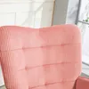 A close-up view of the backrest of a pink corduroy armchair. Náhled obrázku produktu