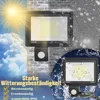 The image shows two LED floodlights mounted on a brick wall, one under a bright sun and clouds, and the other being splashed with water, illustrating their weather resistance. Text highlights features like heat resistance, frost resistance, and IP66 waterp Náhled obrázku produktu