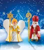 Two Playmobil figures, a St. Nicholas and a Christmas angel, stand in a snowy, festive scene with a castle in the background. Produktbild-Vorschau