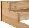 A close-up view of a wooden raised garden bed. Produktbild-Vorschau