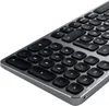 A close-up, angled view of a compact, wireless keyboard. Anteprima dell’immagine prodotto