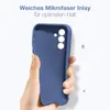 A hand holding a blue phone case against a white background. Produktbild-Vorschau