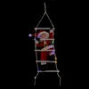 A Santa Claus figure climbing a ladder decorated with colorful lights against a black background. Podgląd zdjęcia produktu