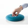 A hand is shown interacting with a teal-colored hot water bottle. Produktbild-Vorschau