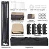 An overhead view of various components and accessories for a pop-up gazebo or pavilion, laid out on a white background. Produktbild-Vorschau